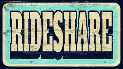 Aged and worn rideshare sign on wood