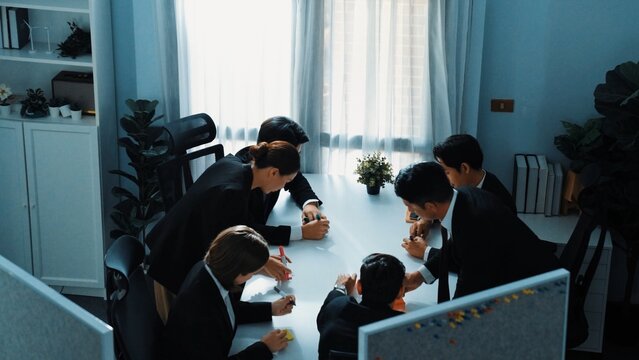 Top view of smart diverse marketing team prepare for business meeting. Professional businesspeople placed laptop and tablet with financial statistic at table. Creative business concept. Directorate. - Powered by Adobe