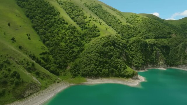 Drone footage capturing the stunning natural beauty of Lake Kezenoyam, the largest and deepest high-altitude lake in the Caucasus Mountains, located on the border of the Chechen Republic and Dagestan,