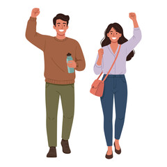 Smiling man and woman celebrating with raised fists