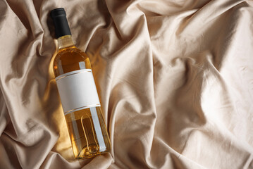 White Wine Bottle and Glass on Satin Background. Elegant Celebration Still Life