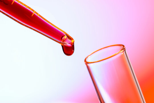 In vitro fertilization. Pipette with liquid sample and test tube on color gradient background, closeup