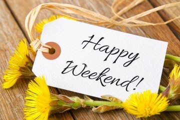 Naklejka premium White Banner with the Words Happy Weekend on it and many yellow Flowers.
