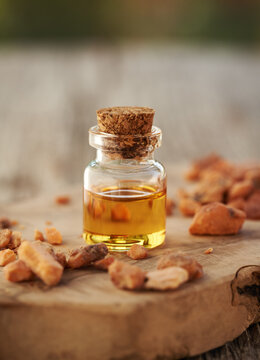 A bottle of essential oil with styrax benzoin resin