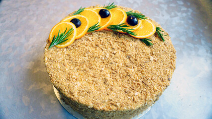 Obraz premium Assortment of Napoleon cake presentations featuring a whole cake, sliced cake, cake missing one piece, and a single slice. Traditional layered pastry dessert with creamy filling, ideal for confectione