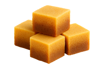 A stack of four golden yellow cube shaped sponge pieces on transparent background