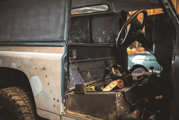 Classic off road vehicle interior undergoing restoration in a workshop