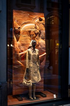 Milan, Italy - 2026, 13 Jan: Striking Gucci FW25 window display with a patterned coat, chic accessories, and artistic backdrop, capturing luxury fashion trends in Milan