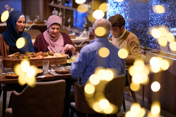 Family gathering for iftar during Ramadan in a restaurant with festive decorations