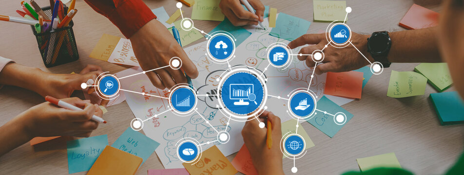 Engaging visual of collaborative brainstorming and analysis session with colorful sticky notes, hands, and digital graphics illustrating creative strategies and ideas. Amity - Powered by Adobe