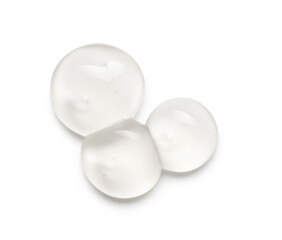 Drops of cosmetic oil on white background