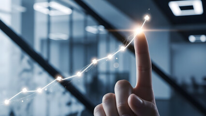 Business growth concept, hand pointing on glowing line chart with arrow rising, symbolizing success and progress