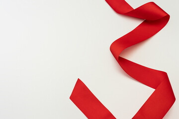 Gray background with a red ribbon