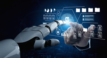 A robot hand interacts with a digital display featuring artificial intelligence elements, showcasing the convergence of technology and innovation in a modern workspace. Gantry