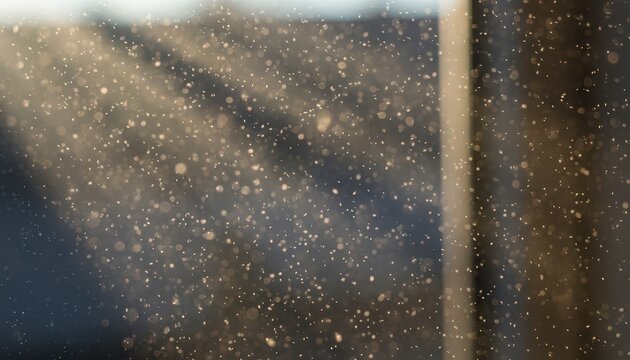 Sunlight illuminating dust motes and particles floating in air in a dark interior space