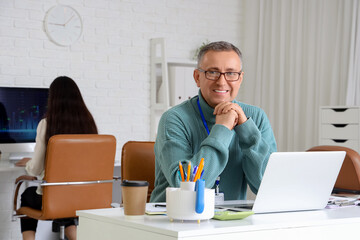 Male business analyst at desk in office. Data science concept