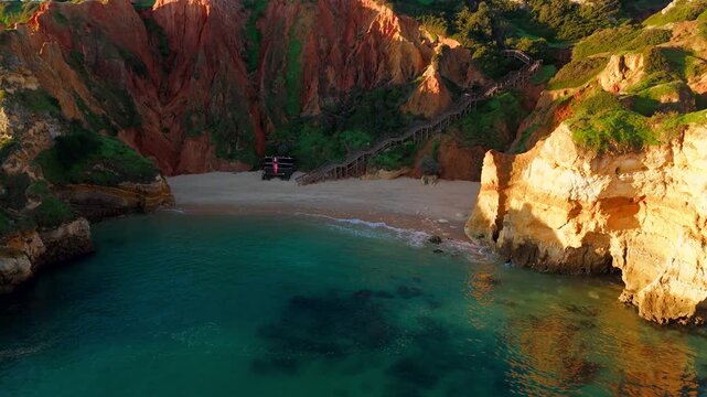 Aerial view of Praia do Camilo Beach and Cliffs in Lagos, Algarve, Portugal