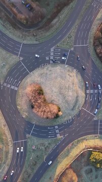 Drone View of Vehicles Moving Through Roundabout in Basingstoke, England, UK