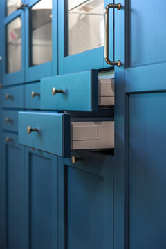 Blue kitchen fronts with clean lines and hardware. Blue cabinetry.