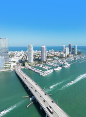 Fototapeta premium MacArthur Causeway in Miami. Biscayne Bay bridge. Miami city panorama with skyscrapers. Miami Beach downtown. Miami ocean shore.