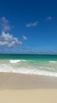 Waimanalo Beach on Oahu's windward coast is a stunning, long stretch of soft white sand and turquoise water, known for its tranquil, less crowded atmosphere. Honolulu, Hawaii