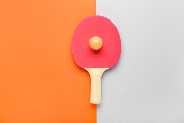 Red ping pong racket and ball on color background