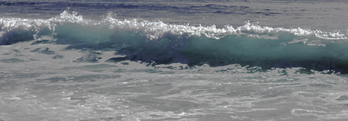 Fototapeta premium Ocean Waves w/Sea Foam Rush in to Shoreline w/Light Illuminating through Small Wave - Backdrop, Background, Border (filtered photo)