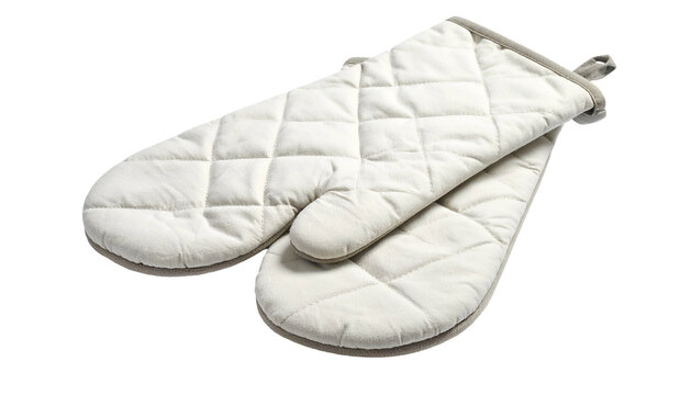 Close-up of two light-colored, quilted oven mitts. One mitt is laying on top of the other, showcasing the diamond stitching and a hanging loop