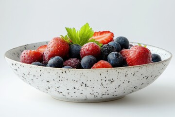 Nutritious meal on a white backdrop featuring a bowl of fresh berries and Icelandic yogurt