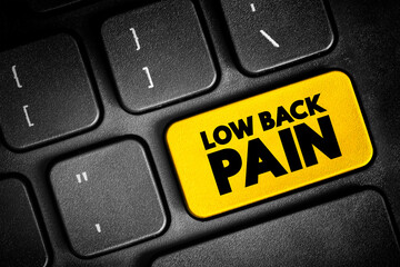 Fototapeta premium Low Back Pain - acute, or short-term back pain lasts a few days to a few weeks, text button on keyboard, concept background