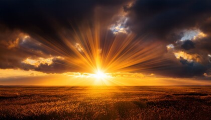 Radiant Golden Sunset Breaking Through Dramatic Dark Clouds Over A Vast Horizon Casting Warm Glowing Rays Across The Sky