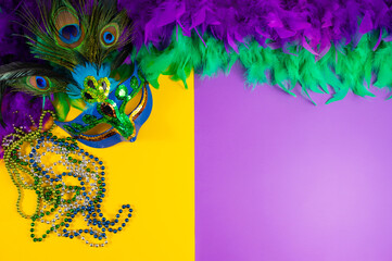 Vibrant Mardi Gras background with mask, beads, and festive decorations