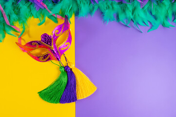 Vibrant Mardi Gras background with mask, beads, and festive decorations