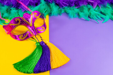 Vibrant Mardi Gras background with mask, beads, and festive decorations