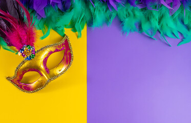 Vibrant Mardi Gras background with mask, beads, and festive decorations