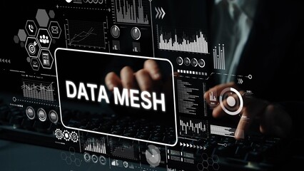 Hands typing on keyboard with digital interface showcasing data analytics and data mesh concepts in a modern workspace. Asymptotic smart data analytic.