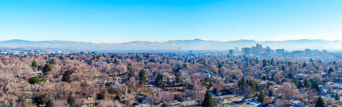 Aerial panoramic view of the City of Reno and Sparks covered in a smoggy haze during a temperature inversion.