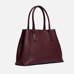 Naklejka premium Women's handbag on a white background.