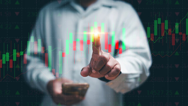 Financial trading and investment analysis concept. Businessman touching candlestick chart. Stock market, data analytics, online trading, price movement, economic growth and investment strategy. - Powered by Adobe