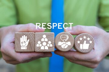 Business person holding wooden blocks sees the text RESPECT. Congratulating with success at work. Employees meeting with respect. Respect Trust Business Concept.