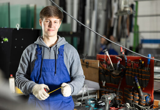 During work process, guy employee produces blanks for repairs and interior decoration. He carries out installation work, products for renovation of residential premises made of glass and plastic.