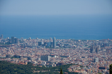 Fototapeta premium Aerial view of Barcelona cityscape and Mediterranean Sea