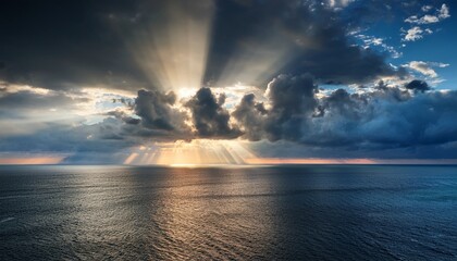 Sunbeams Breaking Through A Dramatic And Cloudy Sky Over The Sea