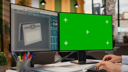 Close up of technician using green screen mockup PC to create solar powered device design with...