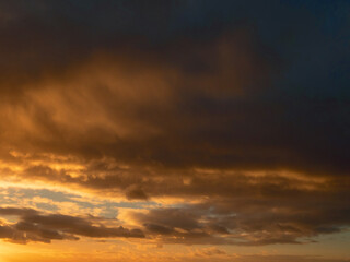 Fototapeta premium Dark dramatic sunset sky. Nature background for design. Strong colors.