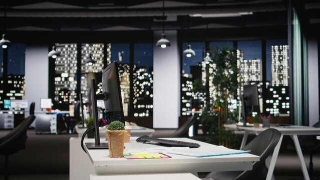 Empty dark office features high tech gadgets and dual monitors, analytics tools ready for business strategy and report writing to support professional growth and organizational success. - Powered by Adobe