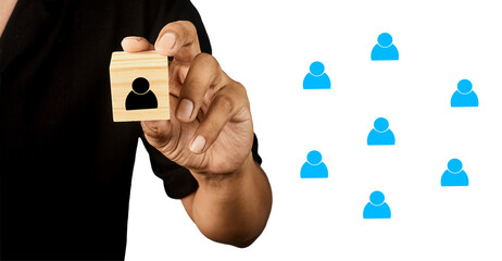 Hand presenting a selected human icon among others representing recruitment and talent selection.
