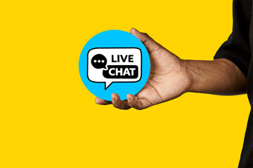 Hand presenting a live chat icon representing real time communication and customer support.
