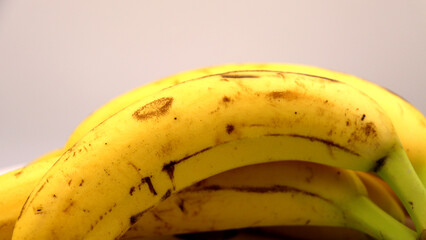 Realistic close-up of ripe yellow bananas.