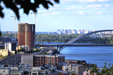 Kyiv cityscape with Dnieper River, bridges, and construction